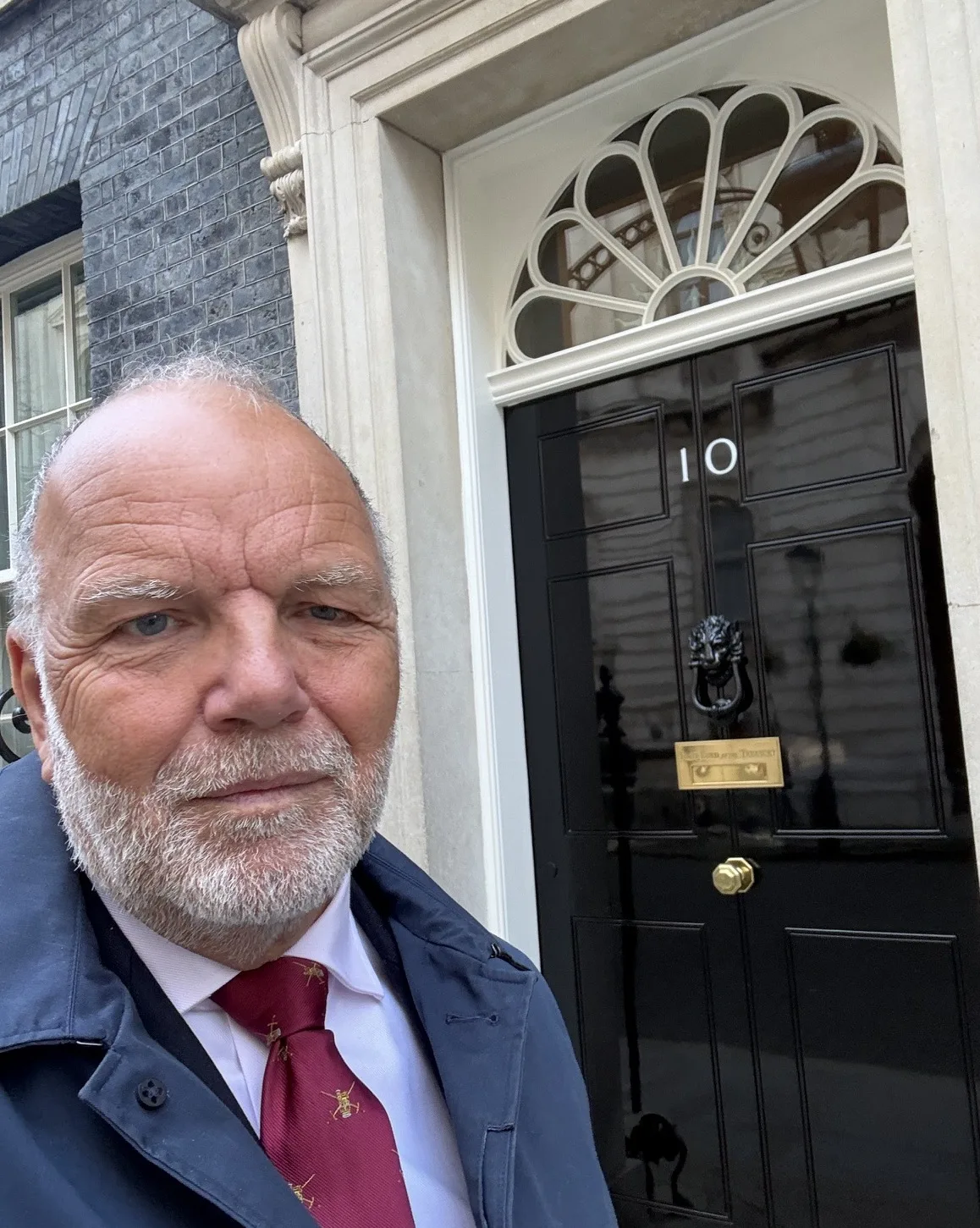 Revd Paul Cowley MBE outside the front door of 10 Downing Street