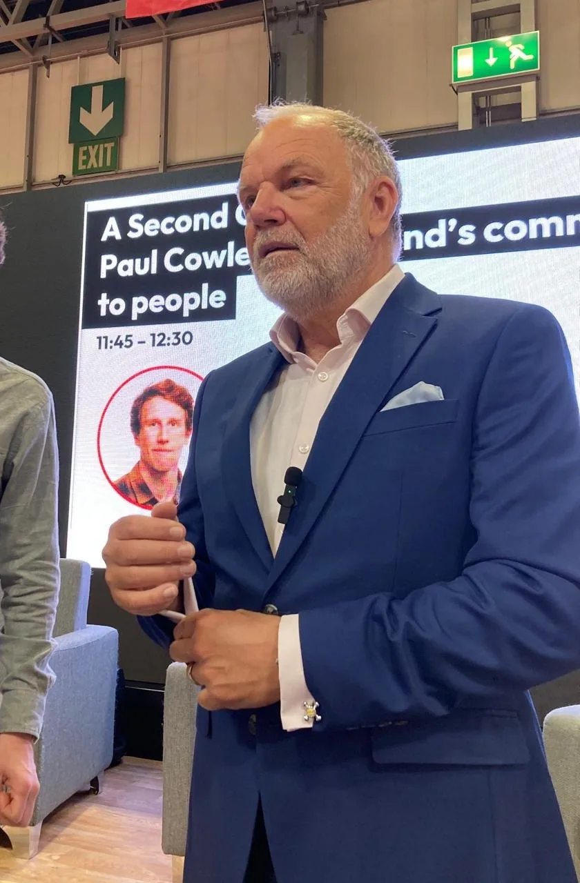 Revd Paul Cowley MBE speaking at the Food & Drink Expo, in front of a screen carrying the title of his Second Chance session